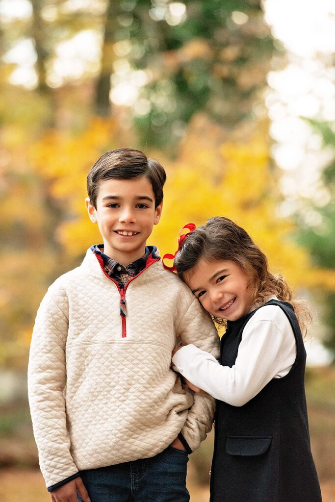 children in sweaters outdoors