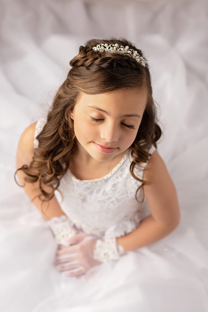 First Communion Portrait of Girl in White Dress