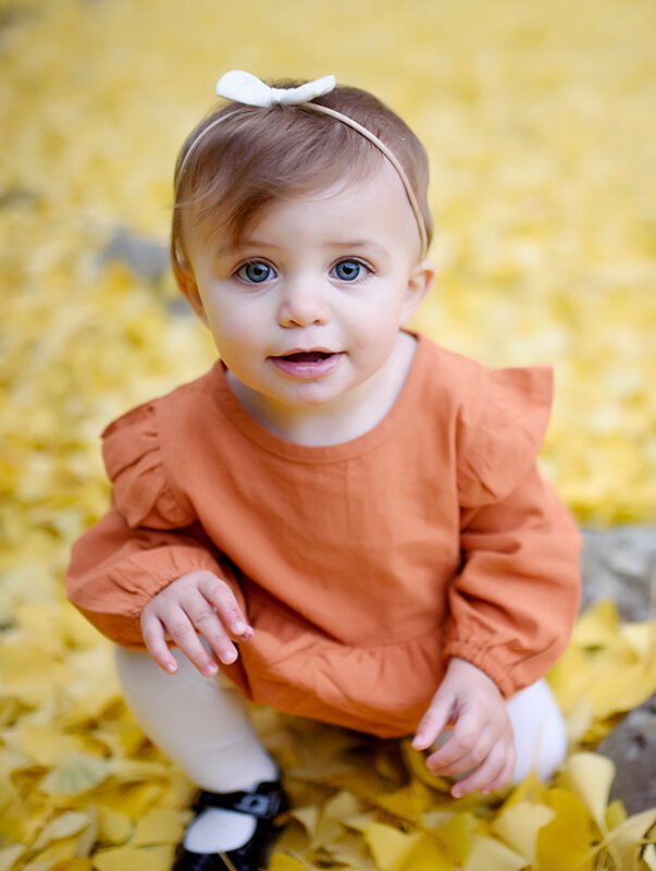 A Little Baby Girl in an Orange Gown